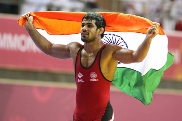 NEW DELHI, INDIA ? OCTOBER 10: India's Sushil Kumar celebrates aftre winning the gold in men's 84 free style wrestling final bout during the Commonwealth Games at the Indira Gandhi Sports Complex in New Delhi on Sunday, October 10, 2010. (Photo by Naveen Jora/India Today Group/Getty Images)